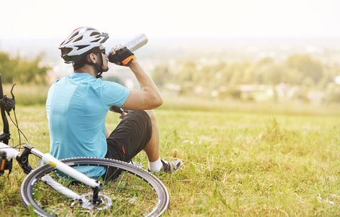 cyclist drinking from bottle