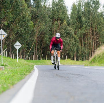 cyclist man is on the roads outside of bogota driving his bicycle