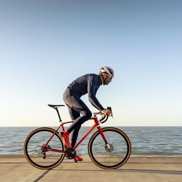 cyclist on path by sea