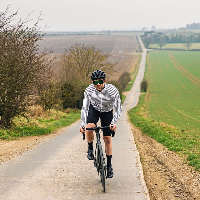 https://hips.hearstapps.com/hmg-prod/images/cyclist-on-road-in-countryside-royalty-free-image-1637680154.jpg?crop=0.66635xw:1xh;center,top&resize=640:*