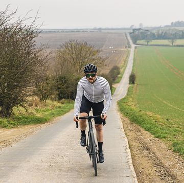 hill workouts cyclist on road in countryside