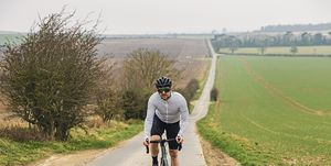 hill workouts cyclist on road in countryside