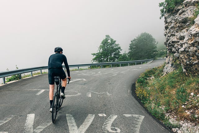 cyclist on the col de la colombiere in the french alps