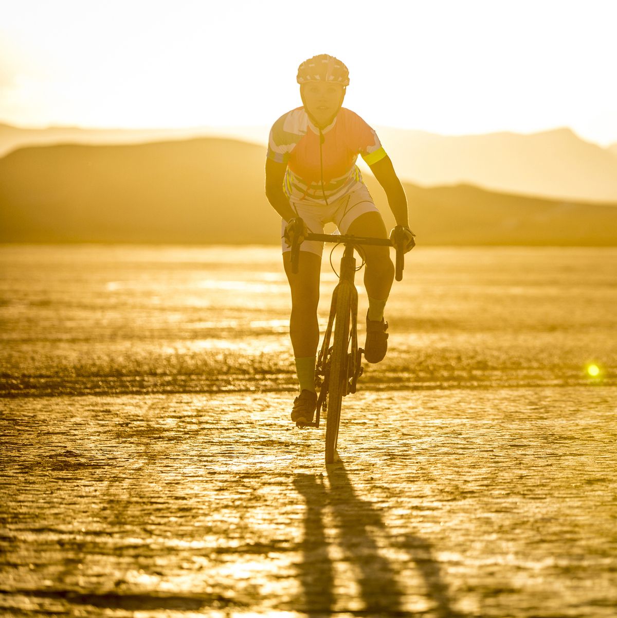 Cyclist riding across desert, Las Vegas, Nevada, USA