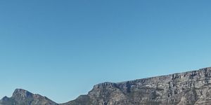 cyclist with cape town's table mountain behind