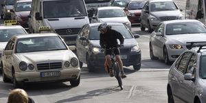 Cyclists and cars in traffic, Leipziger Strasse, Berlin, Germany