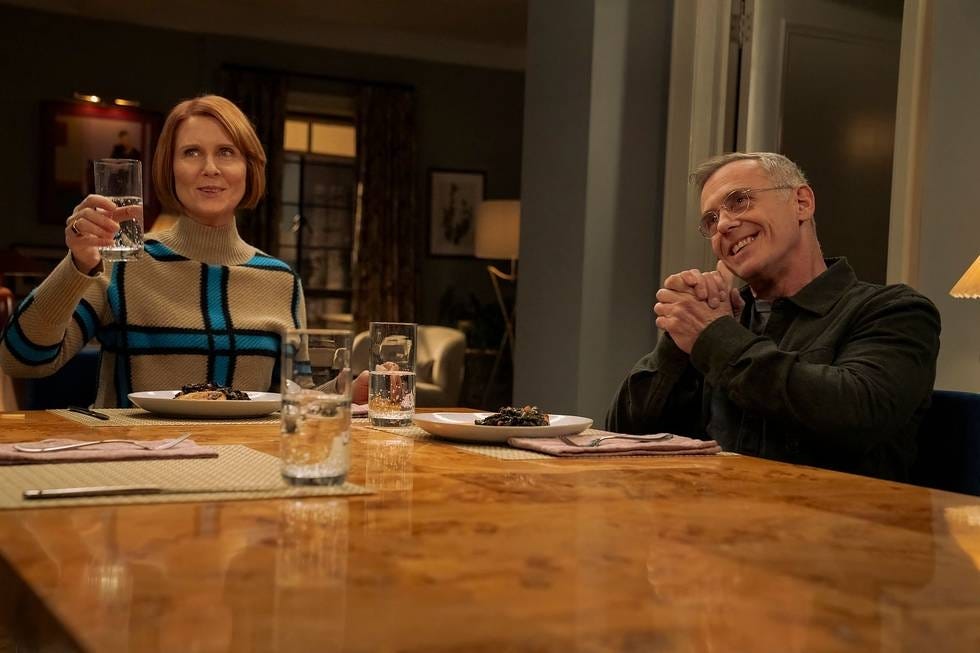 a dining scene featuring two people with food on the table