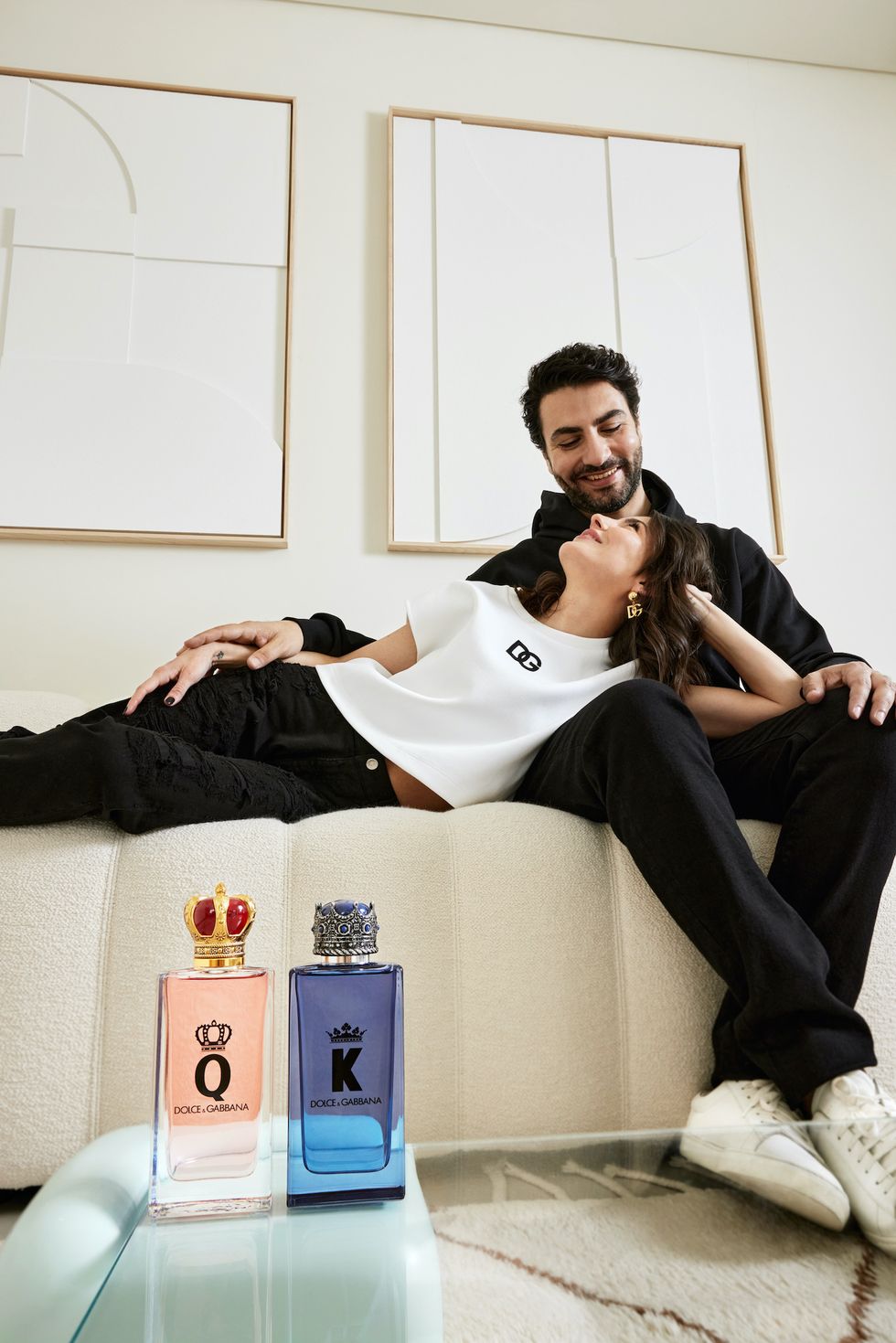 alexandra pereira and ghassan fallaha on a sofa with k and q fragrance