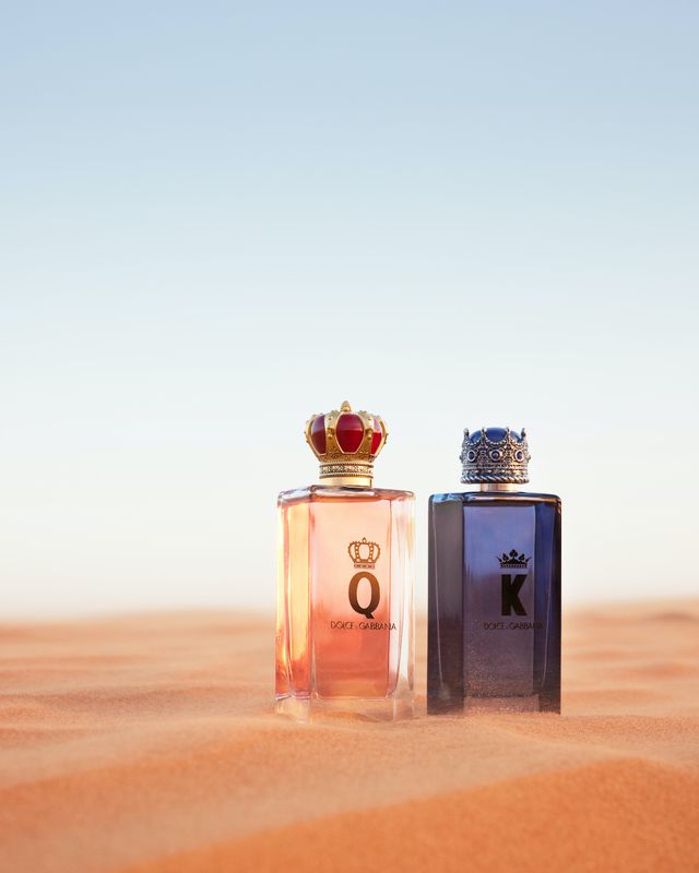 bottles of dandg kandq fragrances on sand