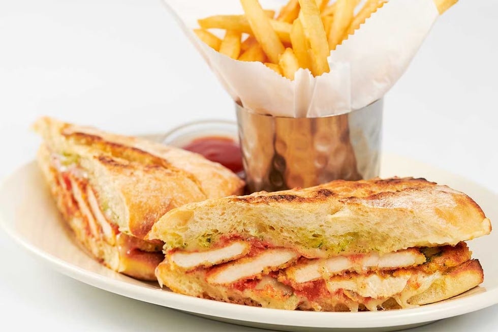 grilled chicken sandwich with fries and dipping sauce