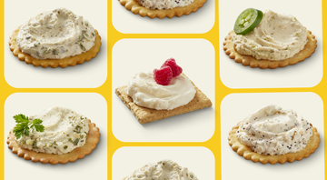 assortment of crackers topped with various spreads and garnishes