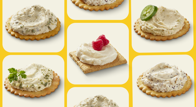 assortment of crackers topped with various spreads and garnishes