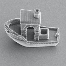 3d benchy, a tiny 3d printed boat that is about 13 the size of a strand of hair
