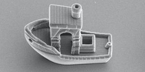 3d benchy, a tiny 3d printed boat that is about 13 the size of a strand of hair