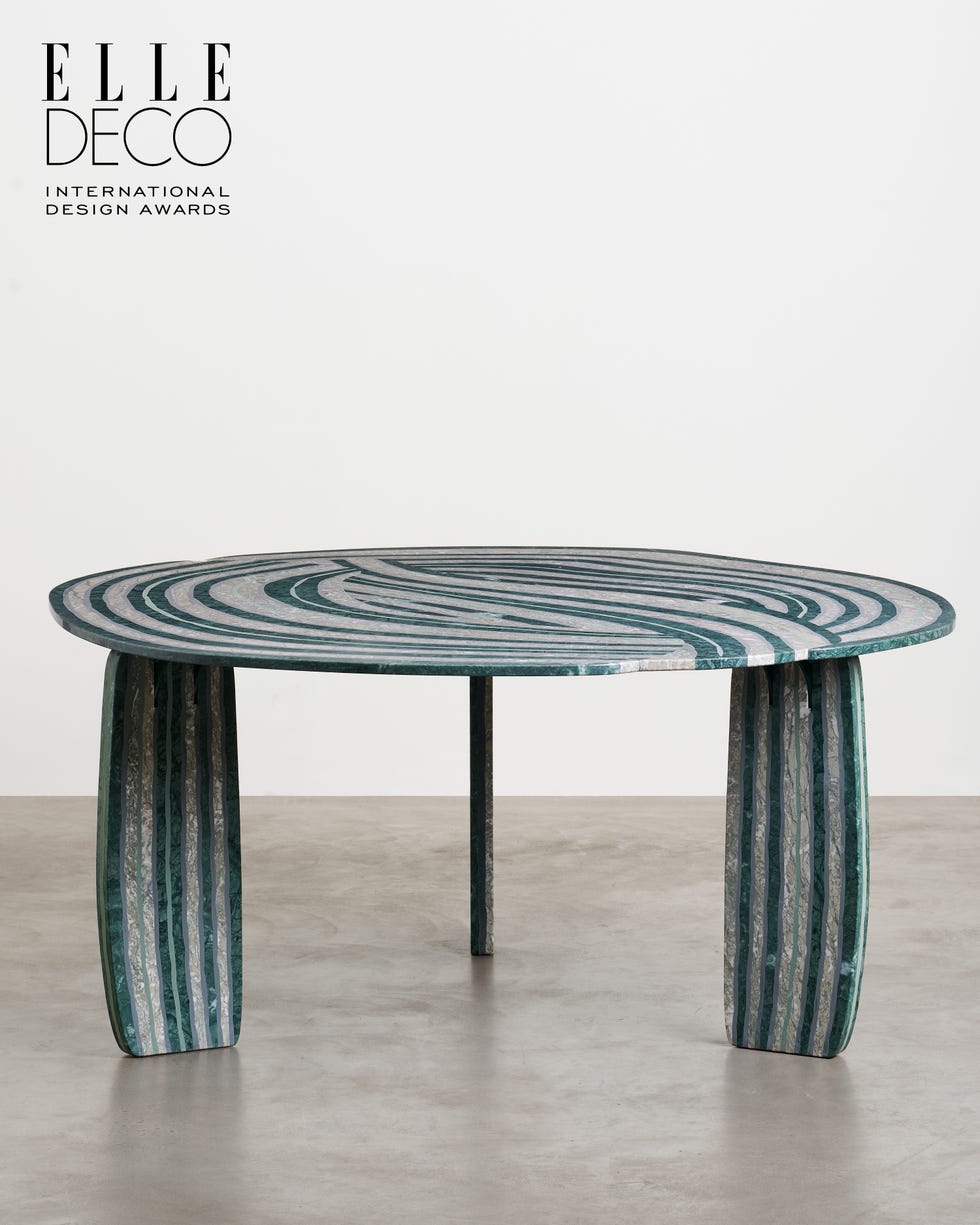 Modern dining table with a unique striped design. Modern dining table with a unique striped design.