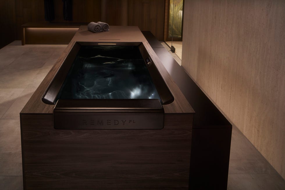Therapeutic bath with a sleek wooden cabinet design.