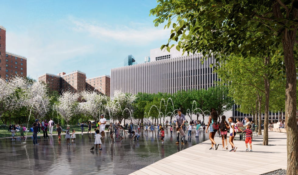 Public park with a water feature and families enjoying recreational activities.