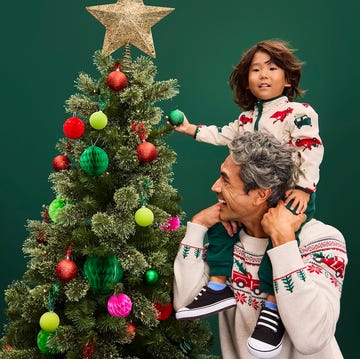 dad son decorating christmas tree dad son decorating christmas tree