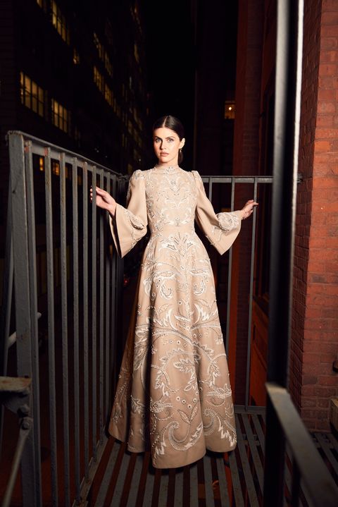 alexandra daddario on a fire escape in a wool crepe dior gown