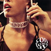 young woman talking on a flip phone and putting on lip gloss, wearing a diamond choker that says "daddy"