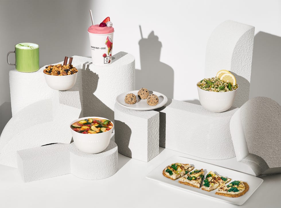 an assortment of prepared vegan meals on a white background from daily harvest, a good housekeeping pick for best healthy meal delivery service