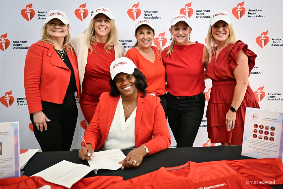 a group of women in red