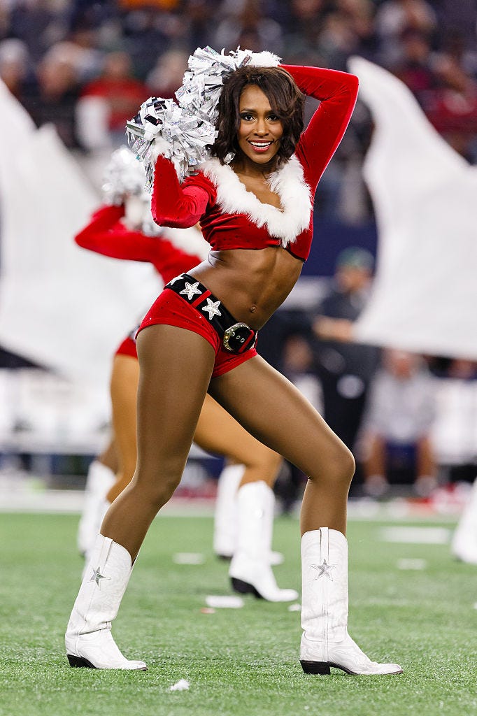 the dallas cowboys cheerleaders perform during halftime of the nfl saturday night game between the new york jets and dallas cowboys at att stadium in arlington, tx photo