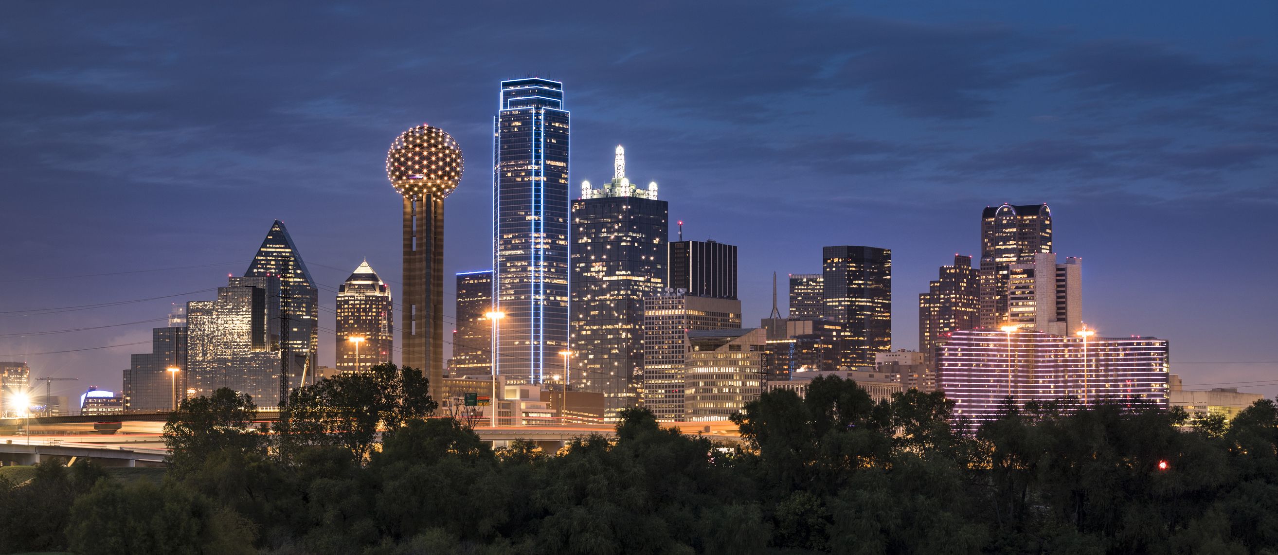 https://hips.hearstapps.com/hmg-prod/images/dallas-texas-skyline-and-reunion-tower-panoramic-royalty-free-image-1621971092.jpg