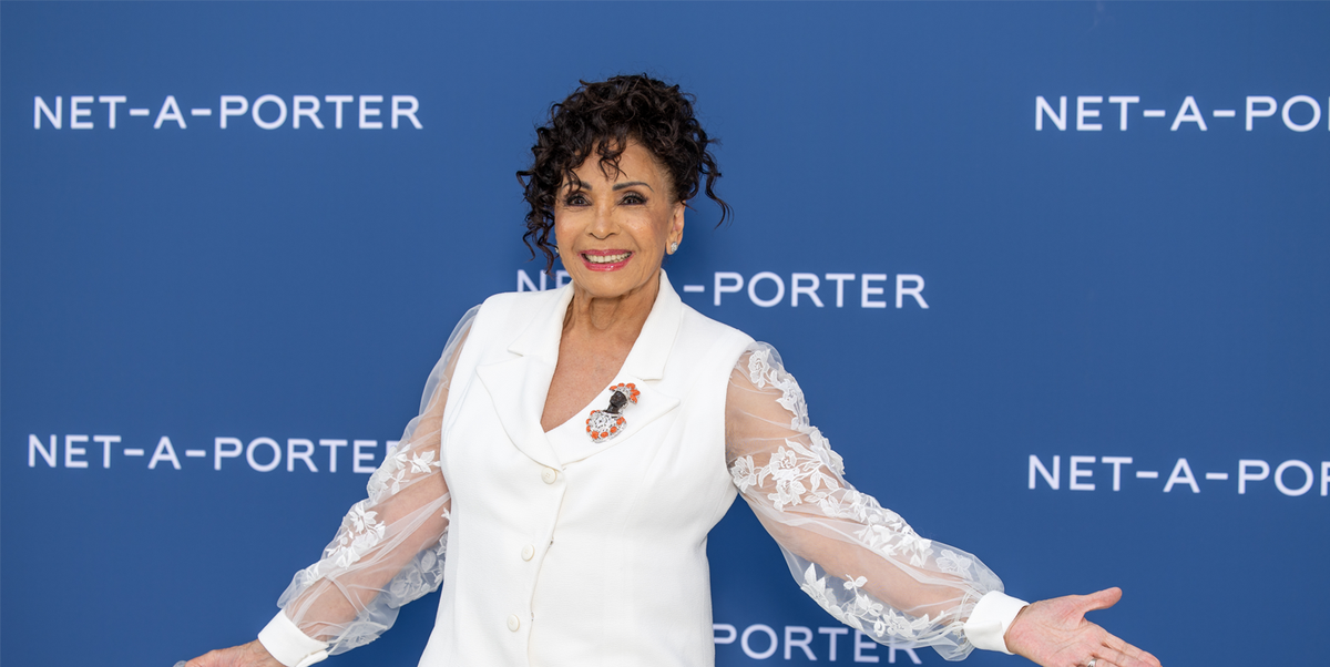 Dame Shirley Bassey wears chic white suit