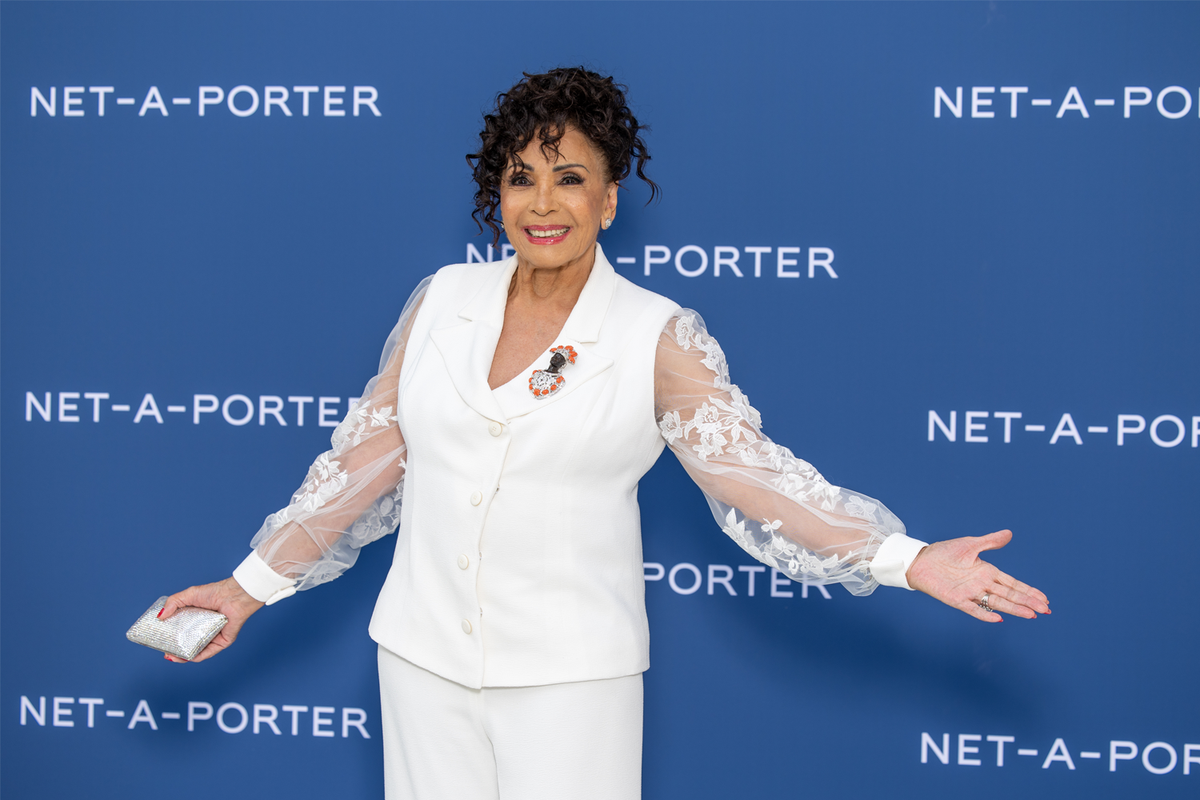 Dame Shirley Bassey wears chic white suit