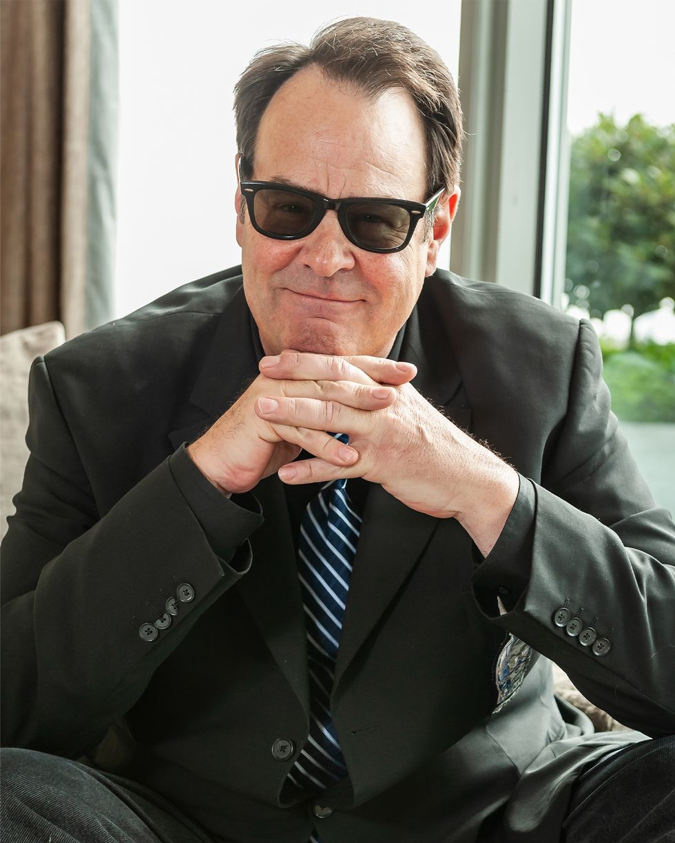 a man wearing sunglasses and a suit