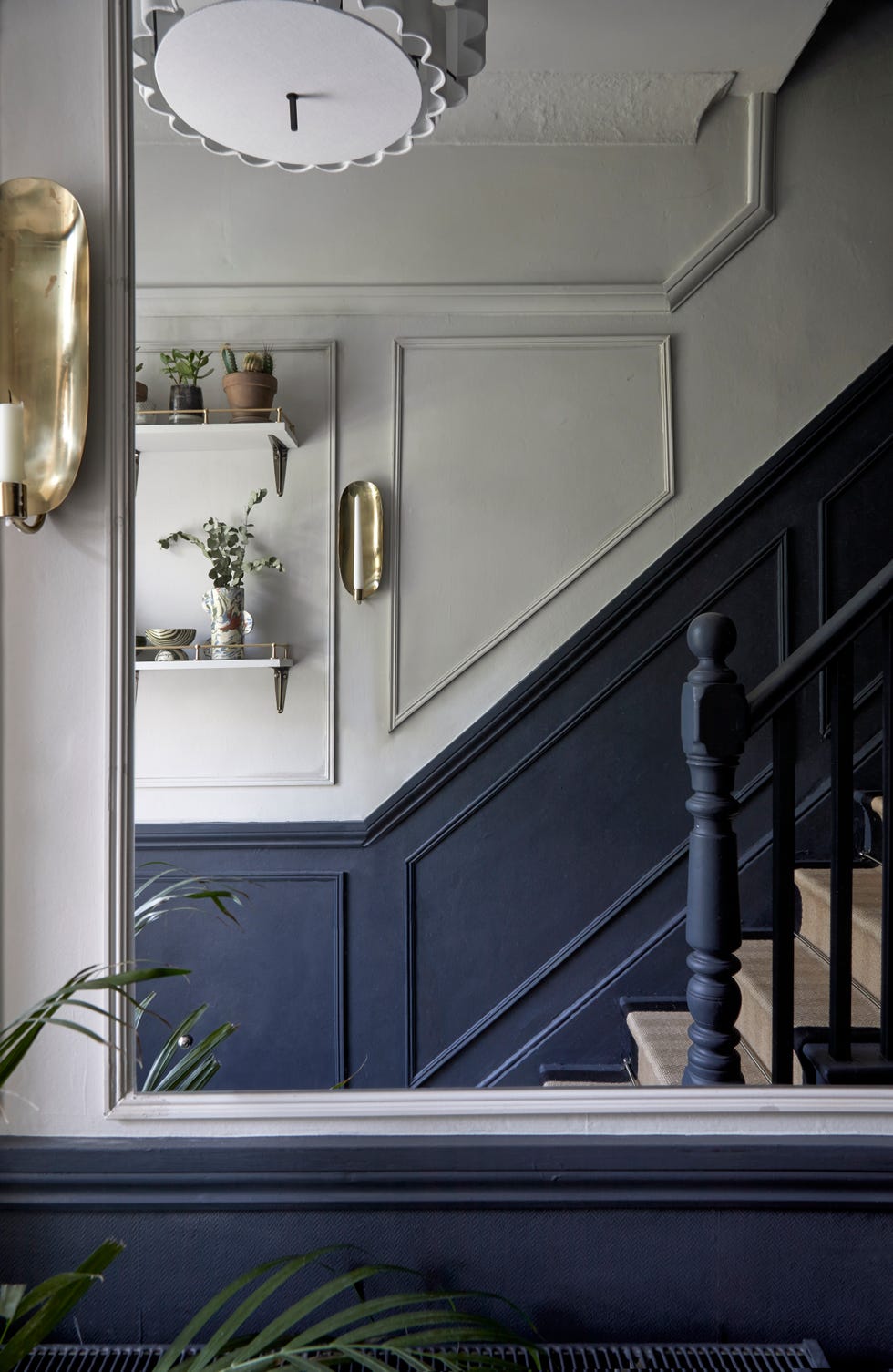 large mirror hanging in hallway