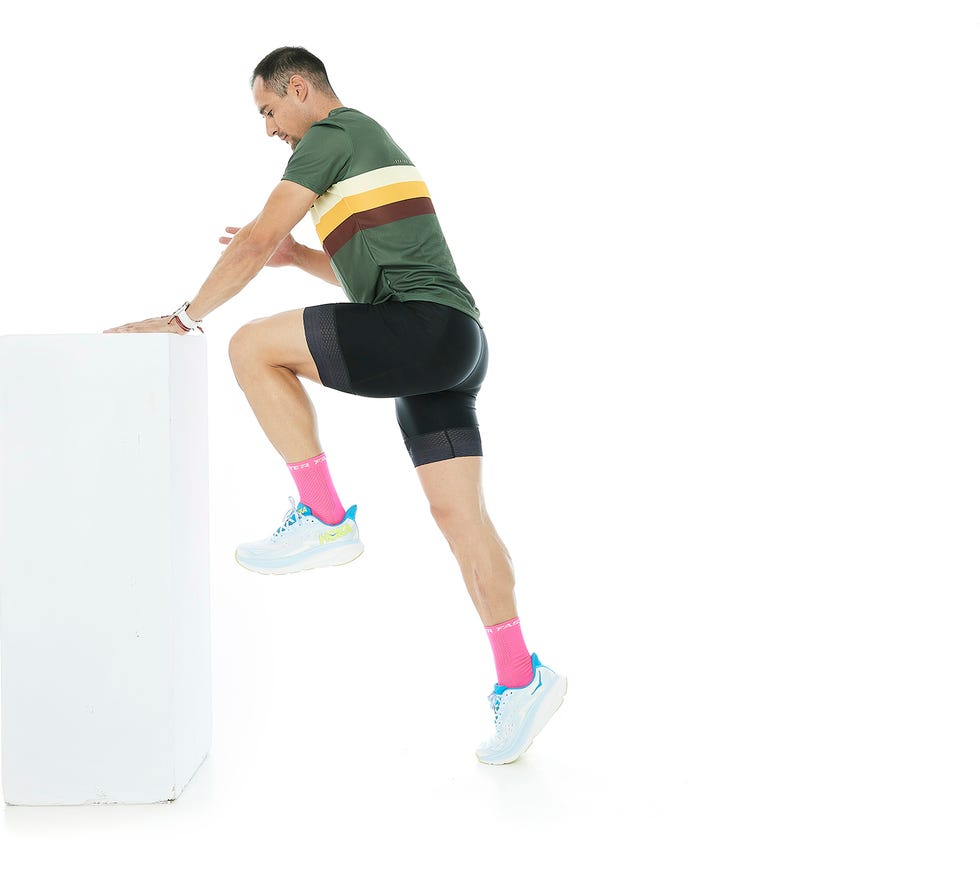 a person leaning against a wall