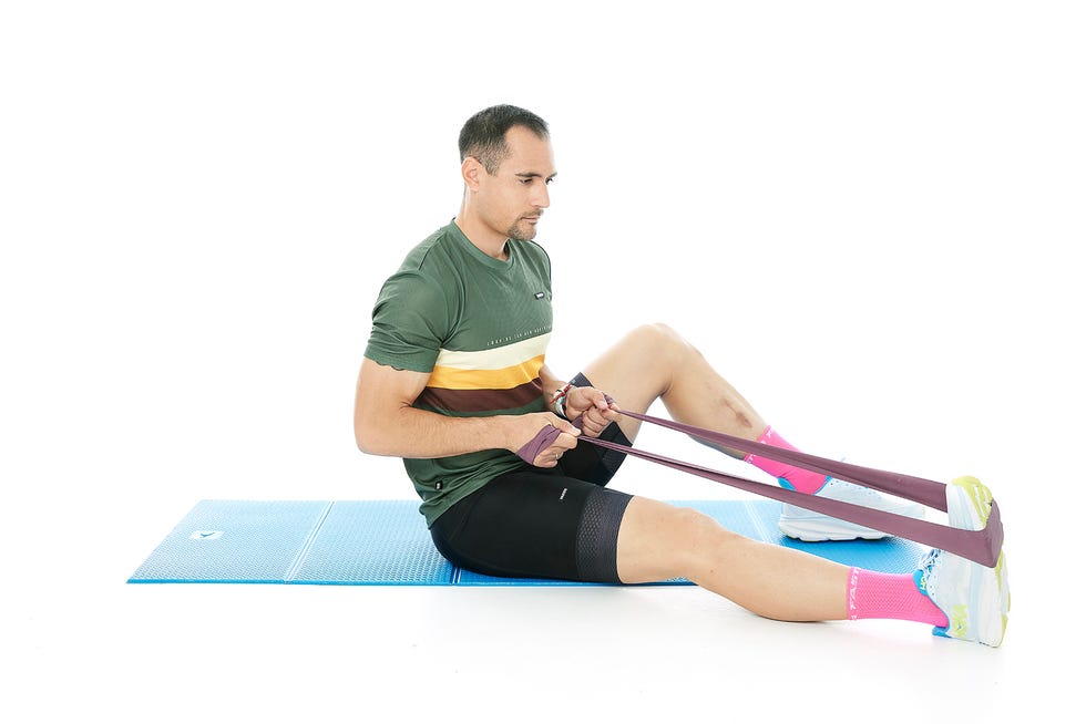 a person sitting on a mat