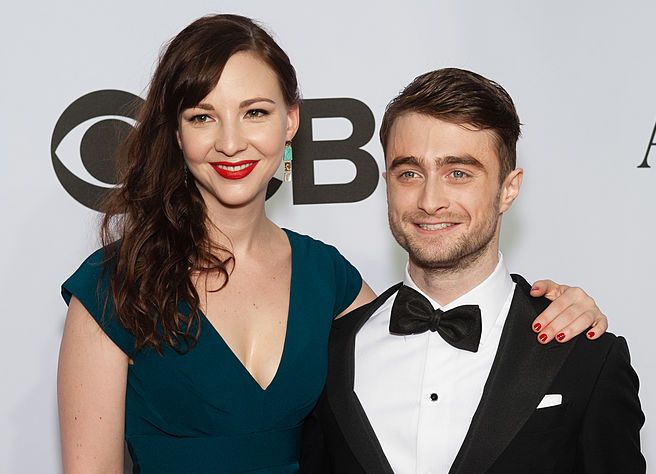 new york, ny june 08 daniel radcliffe r and erin darke attend the american theatre wings 68th annual tony awards at radio city music hall on june 8, 2014 in new york city photo by d dipasupilfilmmagic
