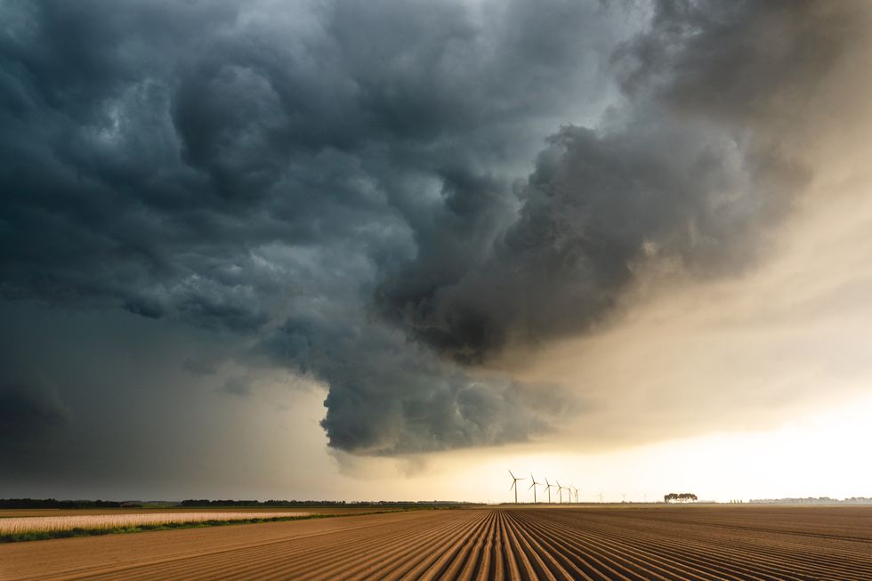 dark clouds over an agricultural field