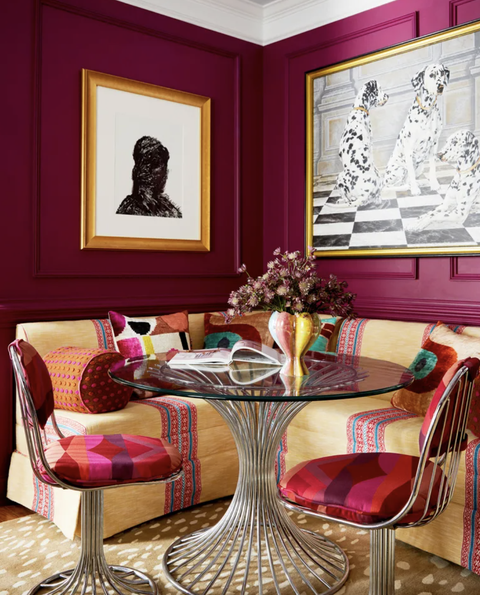 dining area with dark pink walls