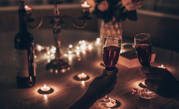 date night ideas with a couple at a candle lit table