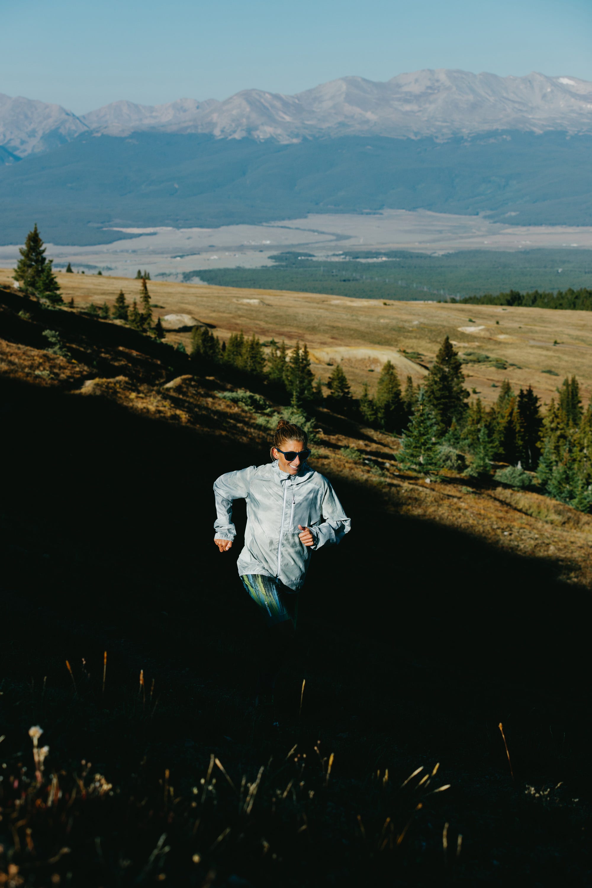 a runner on a mountainous trail
