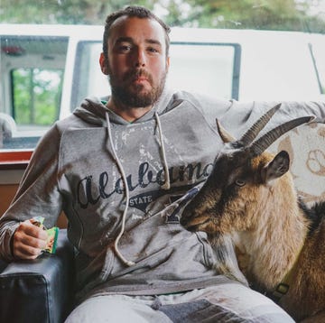 David Paul Cook with a goat friend he met while running 10 Marathons in 10 Days in 2019. David Paul Cook with a goat friend he met while running 10 Marathons in 10 Days in 2019.