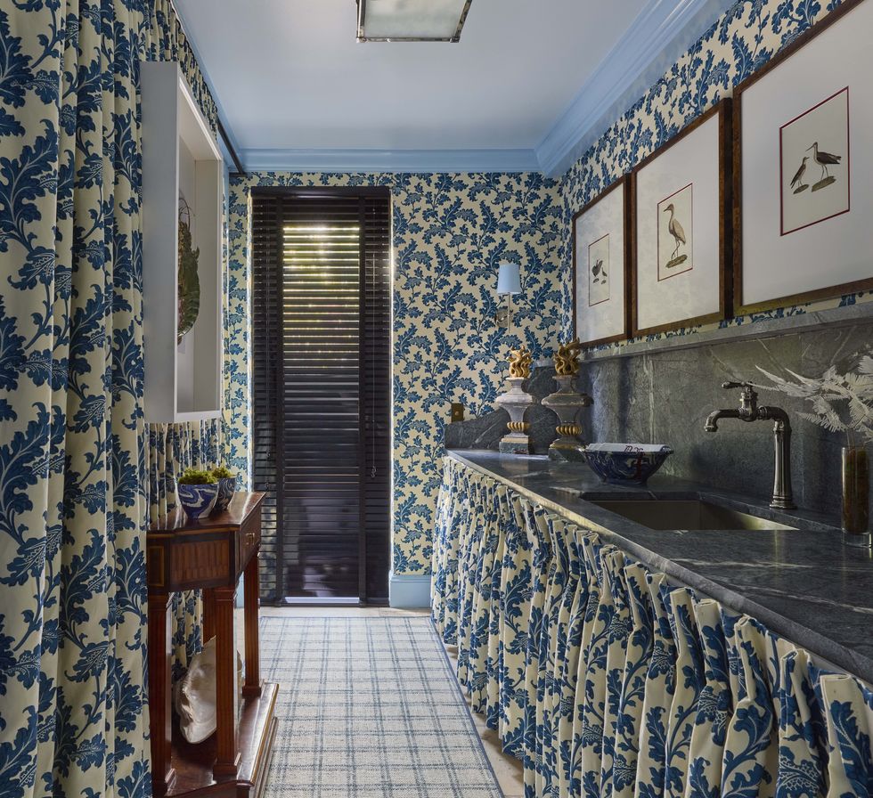 a laundry room with blue and white fabrics