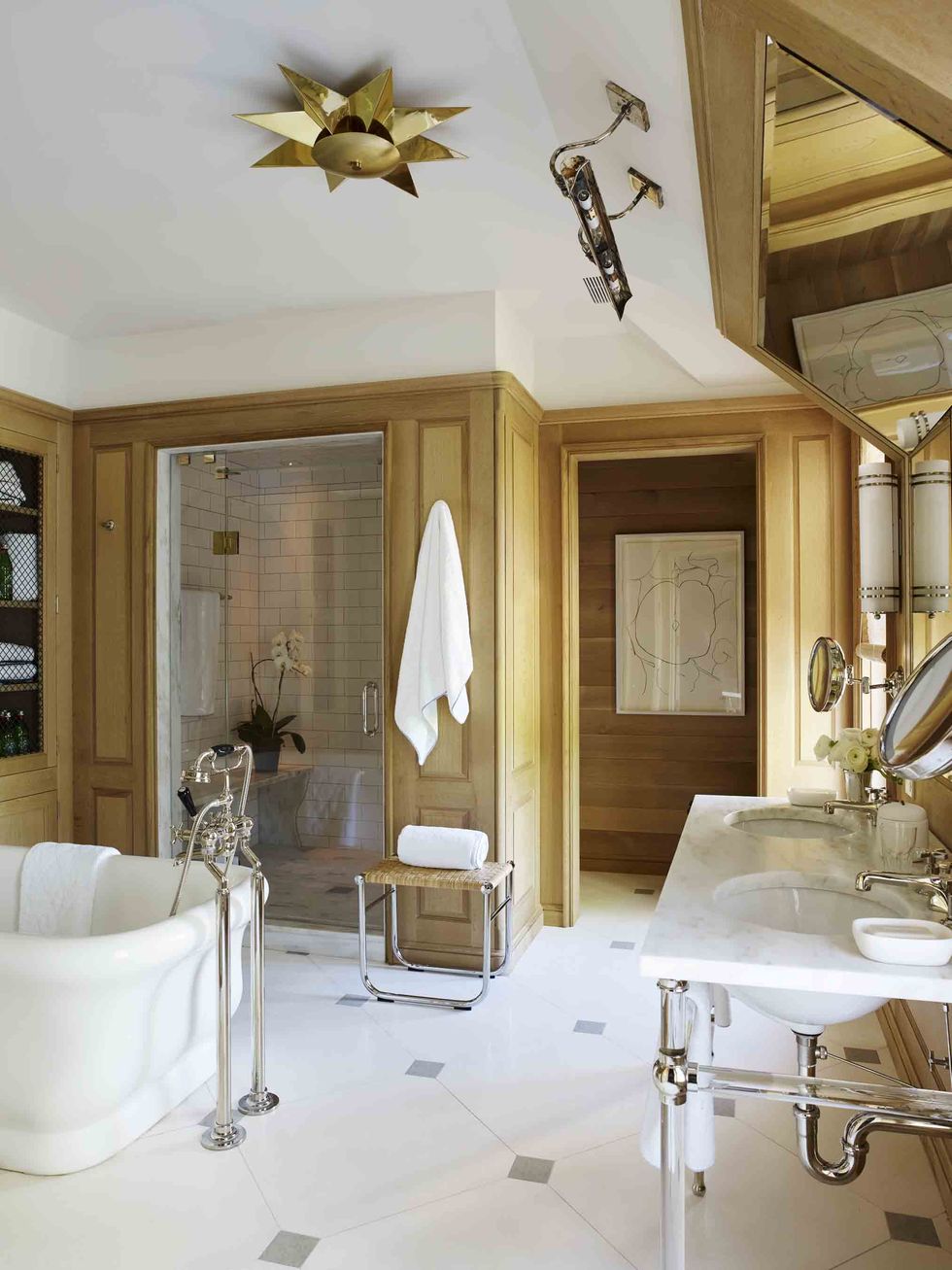 a white marble and wood master bathroom