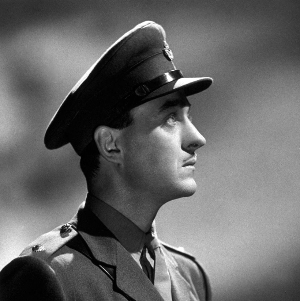david niven posing for a portrait photograph in his military uniform