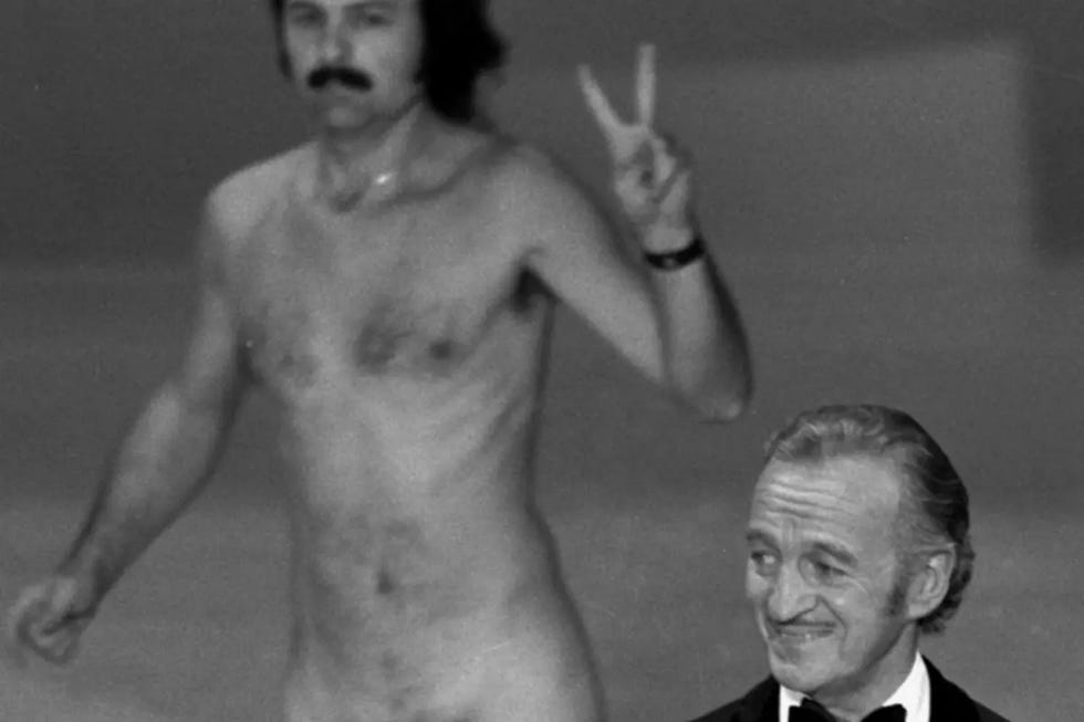 a person with a mustache and a person with no shirt