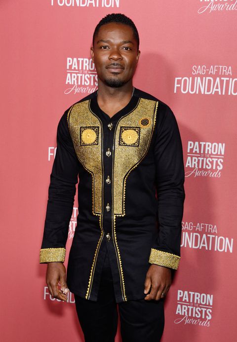 david oyelowo wears a black jacket with gold embellishments on the red carpet