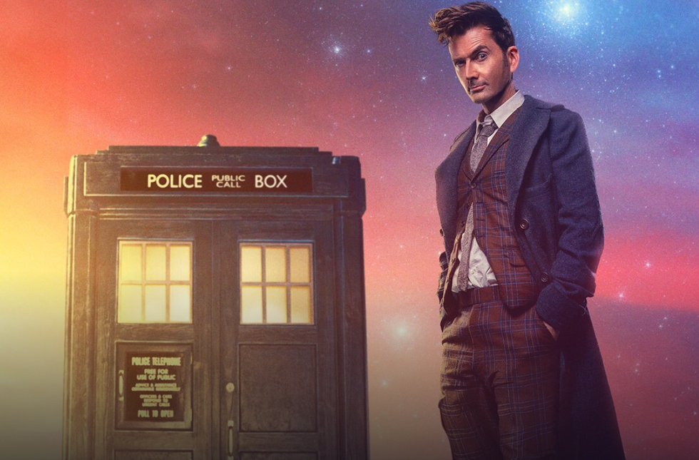 david tennant as the fourteenth doctor in doctor who, standing in front of the tardis with a brightly coloured backdrop