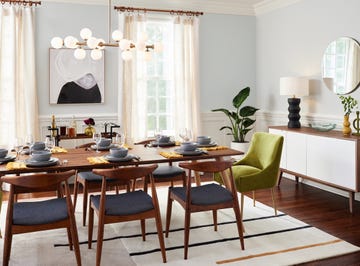 a dining room table with chairs