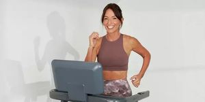 davina mccall wearing a stylish sports bra and leggings on her treadmill