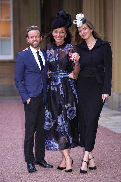 Davina McCall wears navy floral dress to collect her MBE