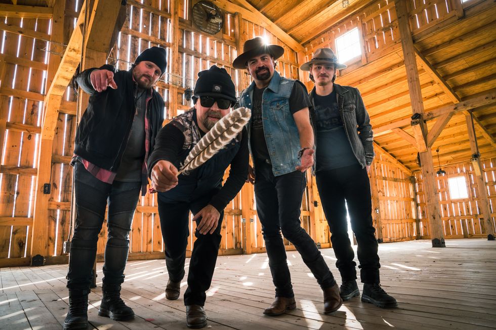 members of davisson brothers band in a wood barn